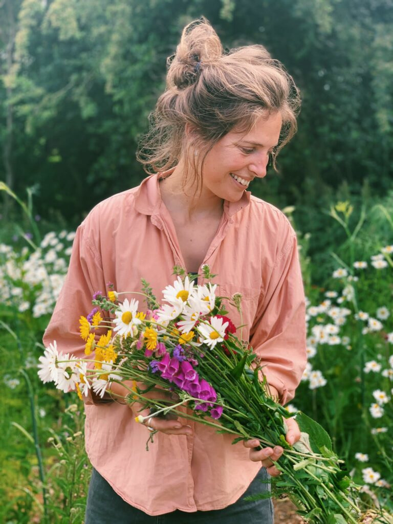 Sally with a freshly picked bunch of wildflowers